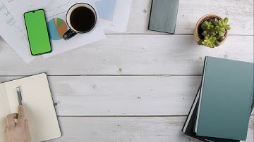 Man Scrolling On Smart Phone with a Green Screen