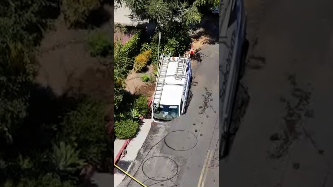 Giant sinkhole partially swallows Spectrum van Giant sinkhole partially swallows Spectrum van