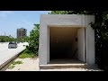 Walking in tunnel under a1a to hugh taylor birch park ft lauderdale