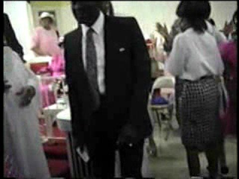 Eld Robert Johnson works the altar during convocat...