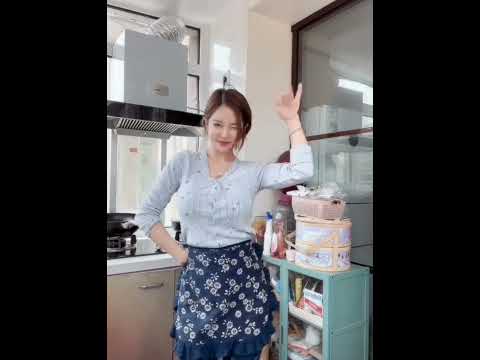 Young Asian Wife Dancing In Kitchen