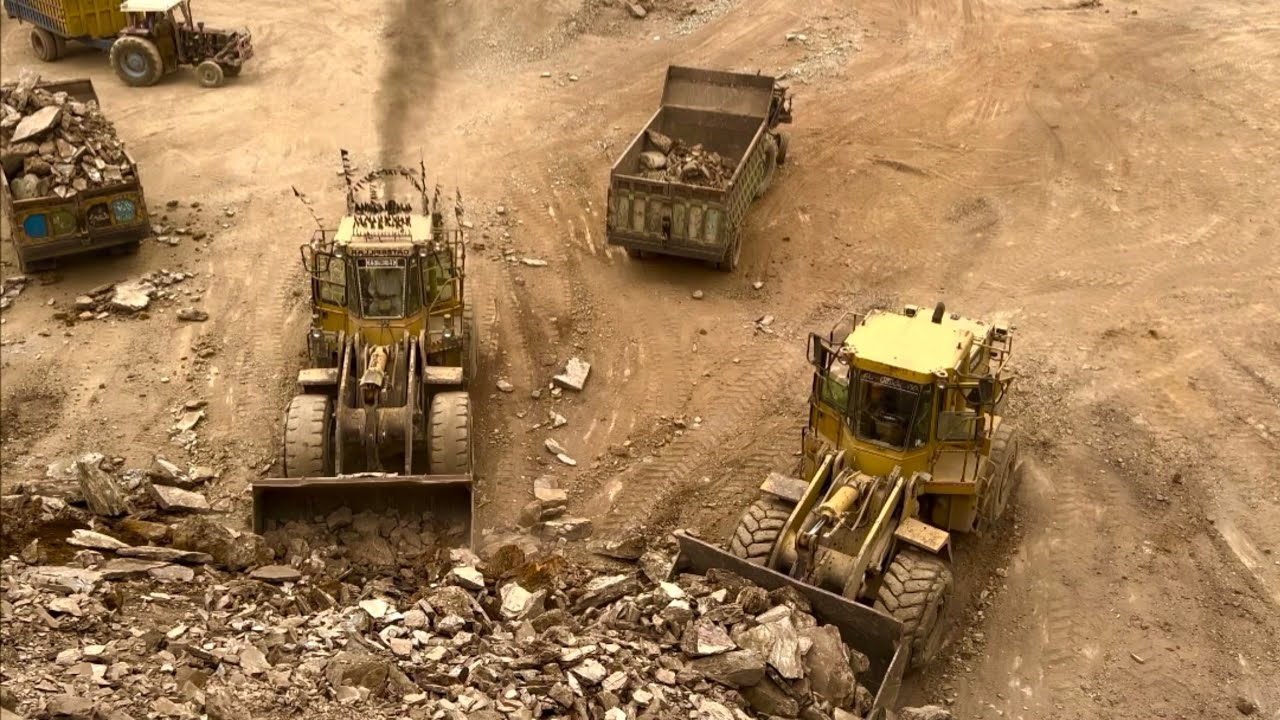 Unstoppable Power! Two Caterpillar Machines Loading Huge Stones into Trolleys