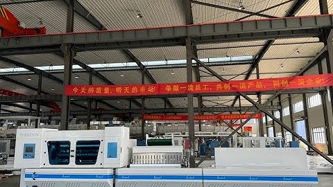 2M WIDE FULLY AUTOMATIC BOPP TAPE SLITTING MACHINE WORKING WITH FLATBED TYPE TAPE PACKING MACHINE