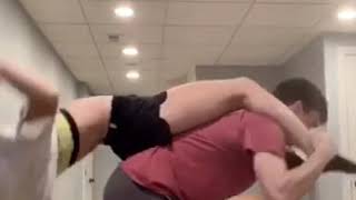 Couple Does Piggy Back Challenge And Girl Hits Her Head On The Ceiling.