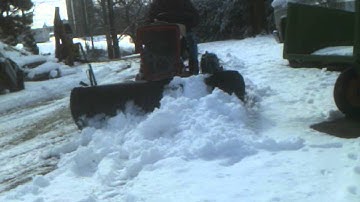 Cub Cadet plowing snow