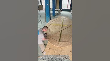 Carpenter Crafts Perfect Circular Shape from Flat Wooden Board Using Precision Tools