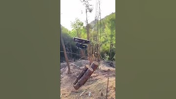 The process of transporting logs downhill using an electric cableway