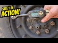 Torquing HMMWV wheels with the digital torque wrench - 10 Piece Color Coded 1/4 Drive Deep Wall Metr