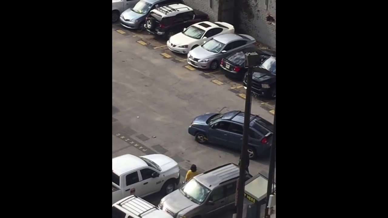 Man gets car booted....fights parking lot attendant!! - YouTube