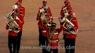 Indian military band from the 1990's singing saare jahan se achha at
republic day. is wearing red coat and black pant, which also worn by
officer...