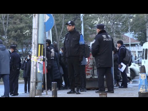 Scene outside Beijing court as hearings for MH370 victims begin | AFP