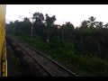 Venad express train 16302 passing through picturesque village