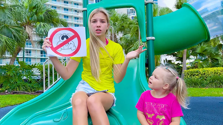 Maggie and little brother play on Playground in th...
