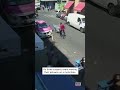 Police woman steps in front of suspects motorbike shorts