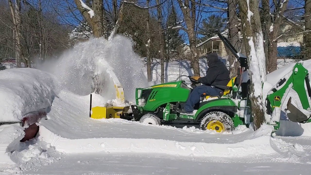 John Deere 1025r with front snow blower in 12inch of snow. YouTube