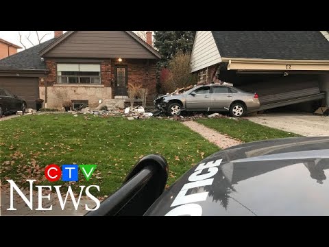 Car slams into Toronto home, teen arrested in connection