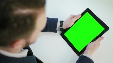 A Man Using an Tablet with a Green Screen | Stock Footage - Videohive