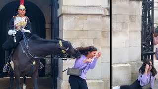 Girl COLLAPSES to the floor after being bitten by the Kings Guard Horse..