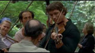 Arnold playing violin from stay hungry screenshot 3