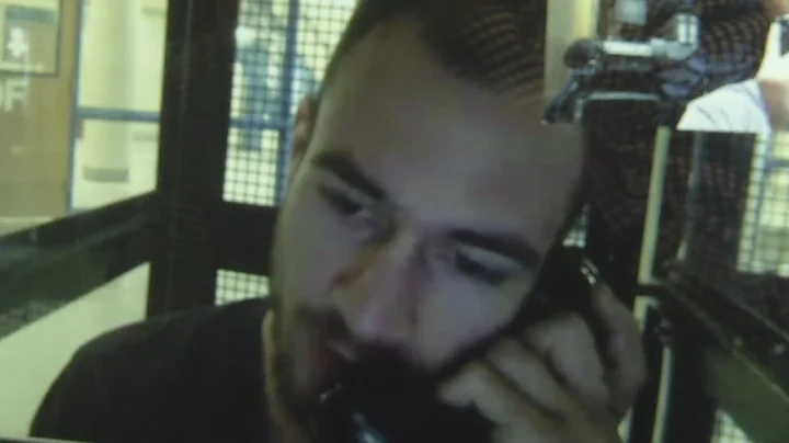 Suspect in girlfriend's death talks from behind ba...