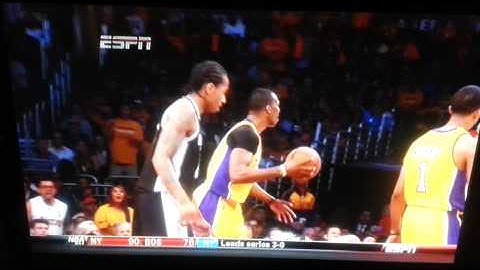 Tim Duncan laughs at an upset Dwight Howard