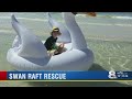 Mom and son trapped on giant swan float miles out in the Gulf