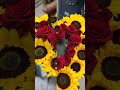 Heartshaped bouquet of sunflowers and roses