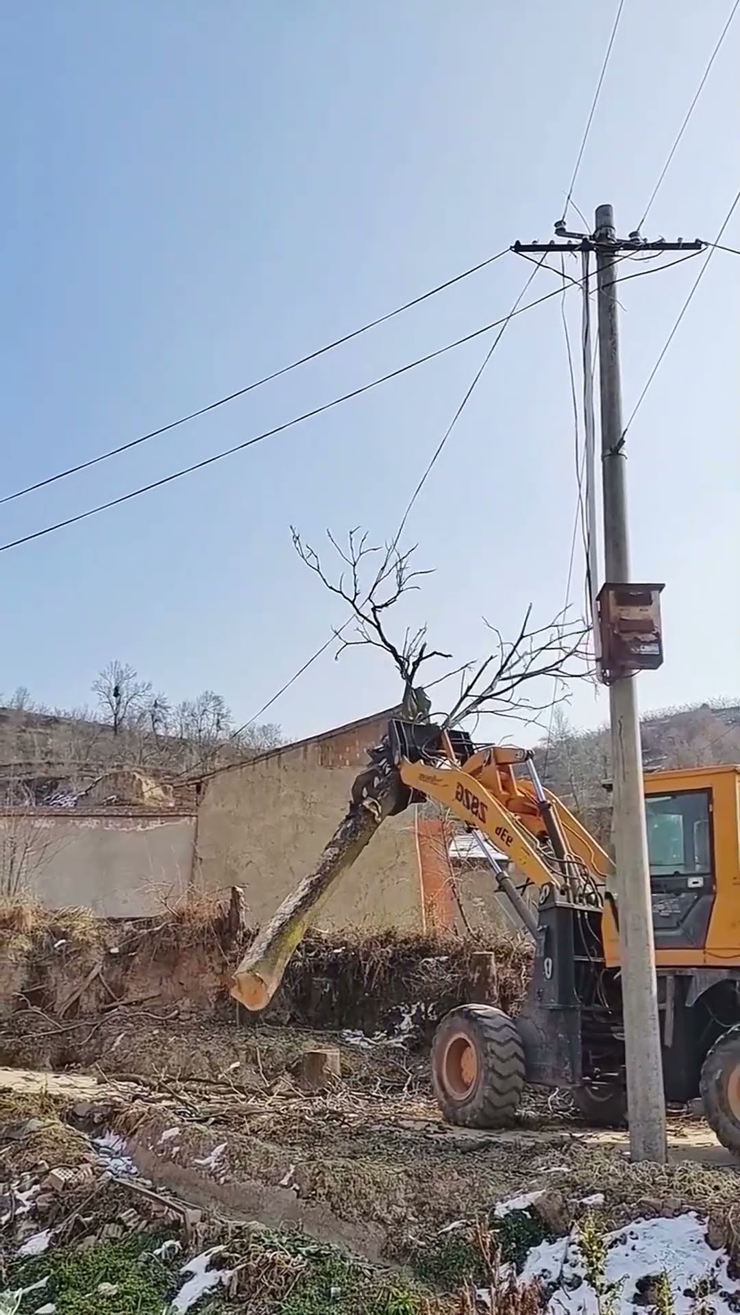 Cut dead wood next to power lines- Good tools and machinery make work easy