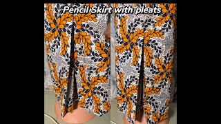 Pencil skirt with cut together pleats