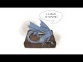 The tiny dragon in the library at Silver Lodge gets a name!