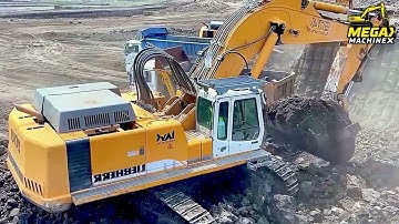 Two Liebherr 974 Excavators Loading Overburden On A Fleet Of Trucks At Busy Mining Site - Ascon Ltd