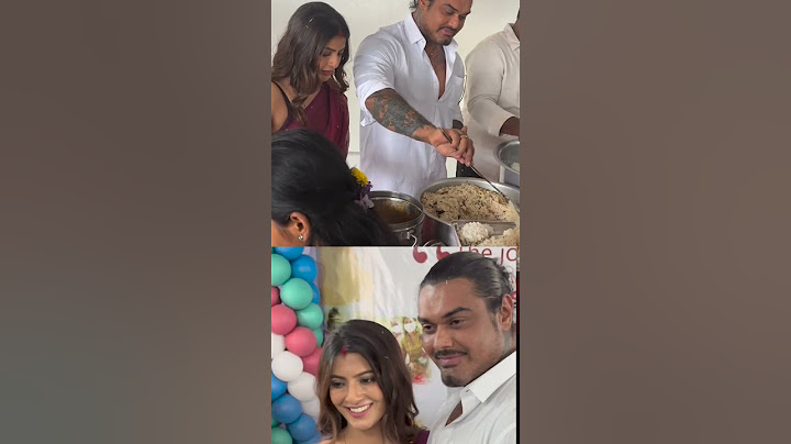 The couple Varalakshmi Sarath Kumar and Nicholai sachdev are serving food to children #trending#love