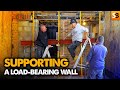 How to support a loadbearing wall when knocking through