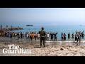 Tens of thousands of migrants cross into Spanish enclave from Morocco