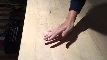 Transfer of a symmetrical image using a projector and tracing paper