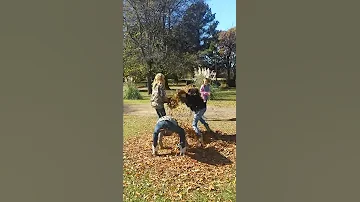 Girls Raking Leaves 