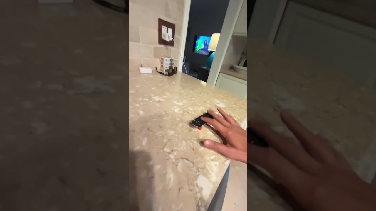 Double tra flip I think/fingerboarding