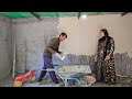 Babak plasters the village house and the family happily helps him