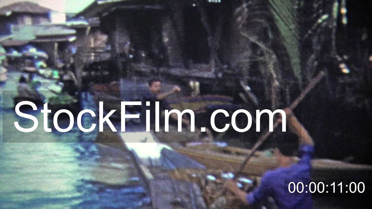 1973: Travel Southeast Asian waterways with merchant boathouses. SINGAPORE