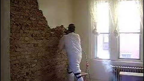 Removing plaster and exposing brick in a South Philly rowhouse