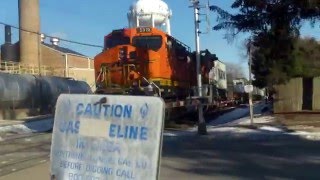 BNSF 7119 leads single Dash 9 on GE trio on EB stack with DPU helper