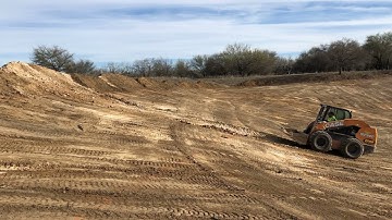 shaping a pond and building pond to apply bentonite