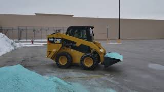 New Cat 246D loading Boss VBX 8000 salt spreader