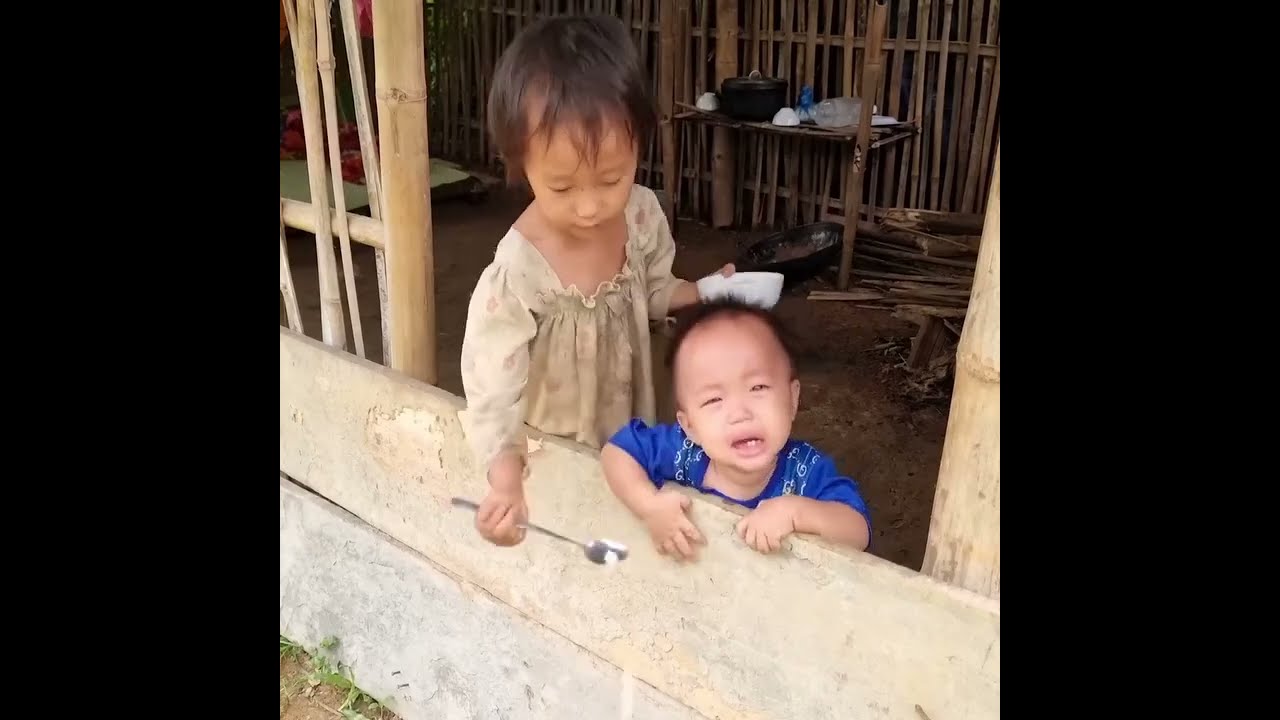 A Sister Picks Vegetables While Caring for a Baby at Home