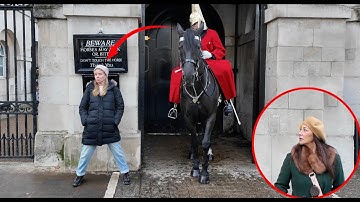 Guard Moves Horse to reprimand her Out of the Box. Other Gives Guard a Nod. 