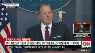 Sean Spicer keeping a straight face while a zebra flexes on his shoulder