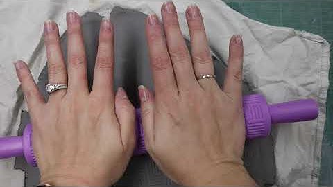 How do I roll out a clay slab?