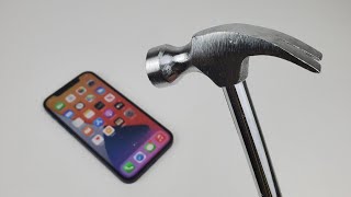 iPhone 12 Durability Test (ULTIMATE) Saw Test, Hammer Test, Staple Gun Test, Fire Test, Bend Test