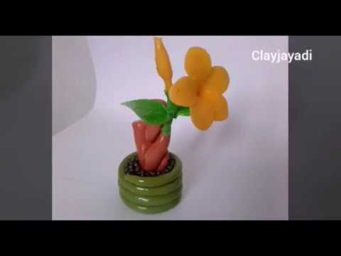 Merangkai bonsai bunga alamanda terbuat dari clay dingin