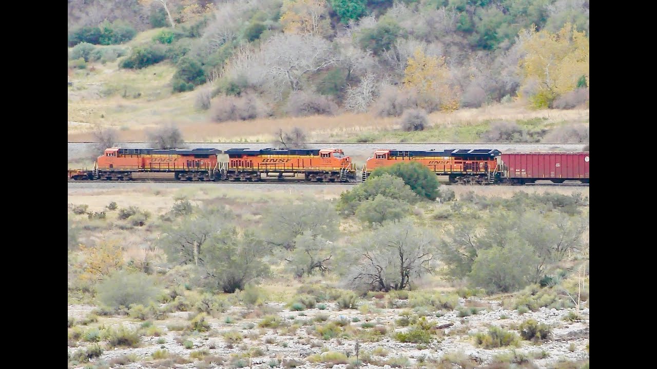 BNSF Meetup between a WB geometry train and EB baretable train near Keenbrook in Cajon Pass CA.